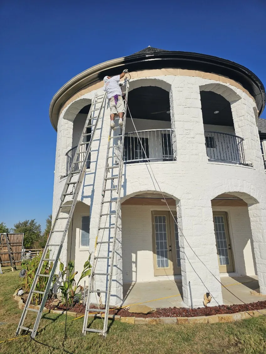 Painting the turret trim black on a white brick exterior