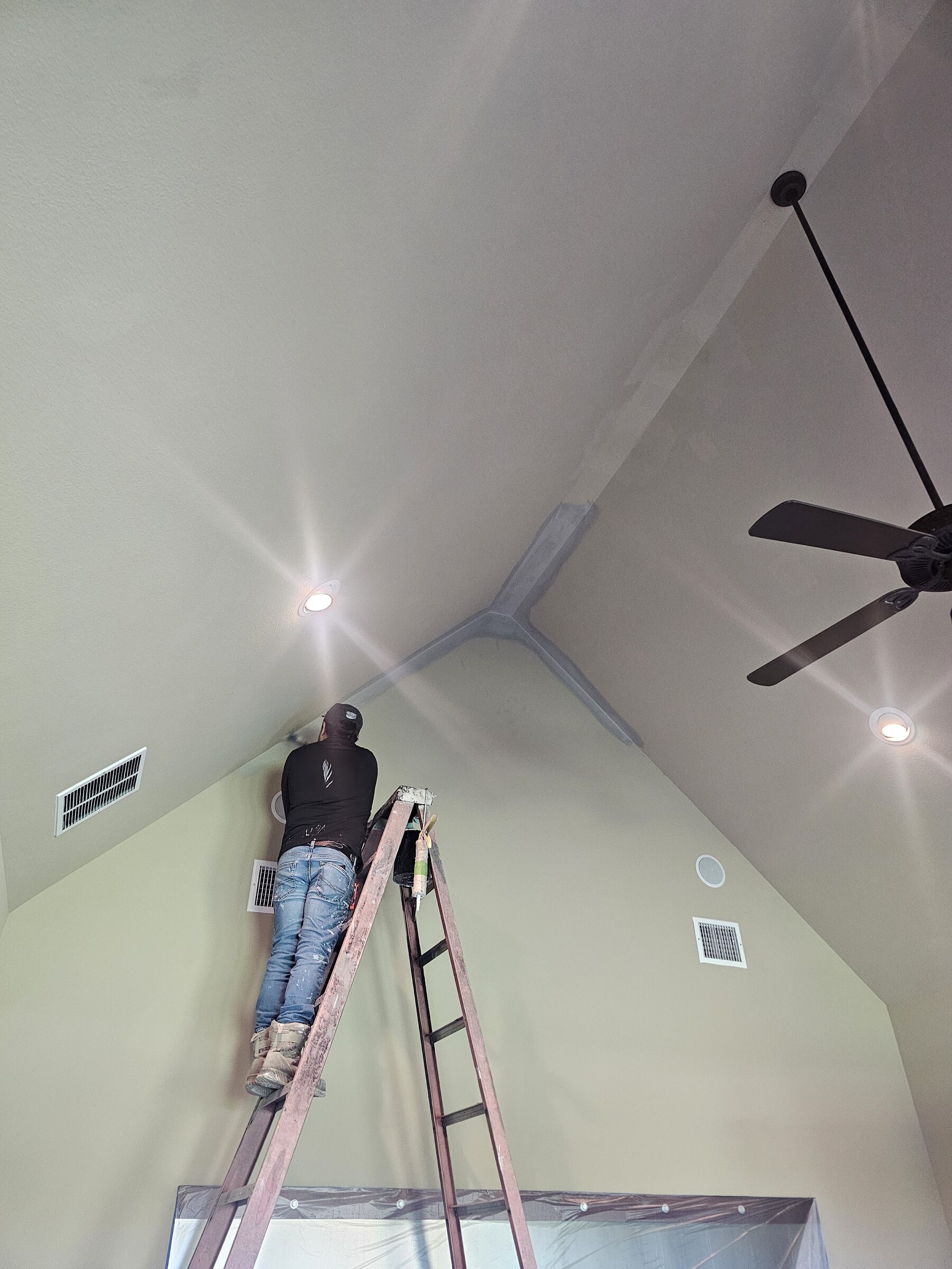 Cabinets being sprayed in-place